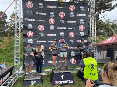 Kate on a podium at a Spartan race